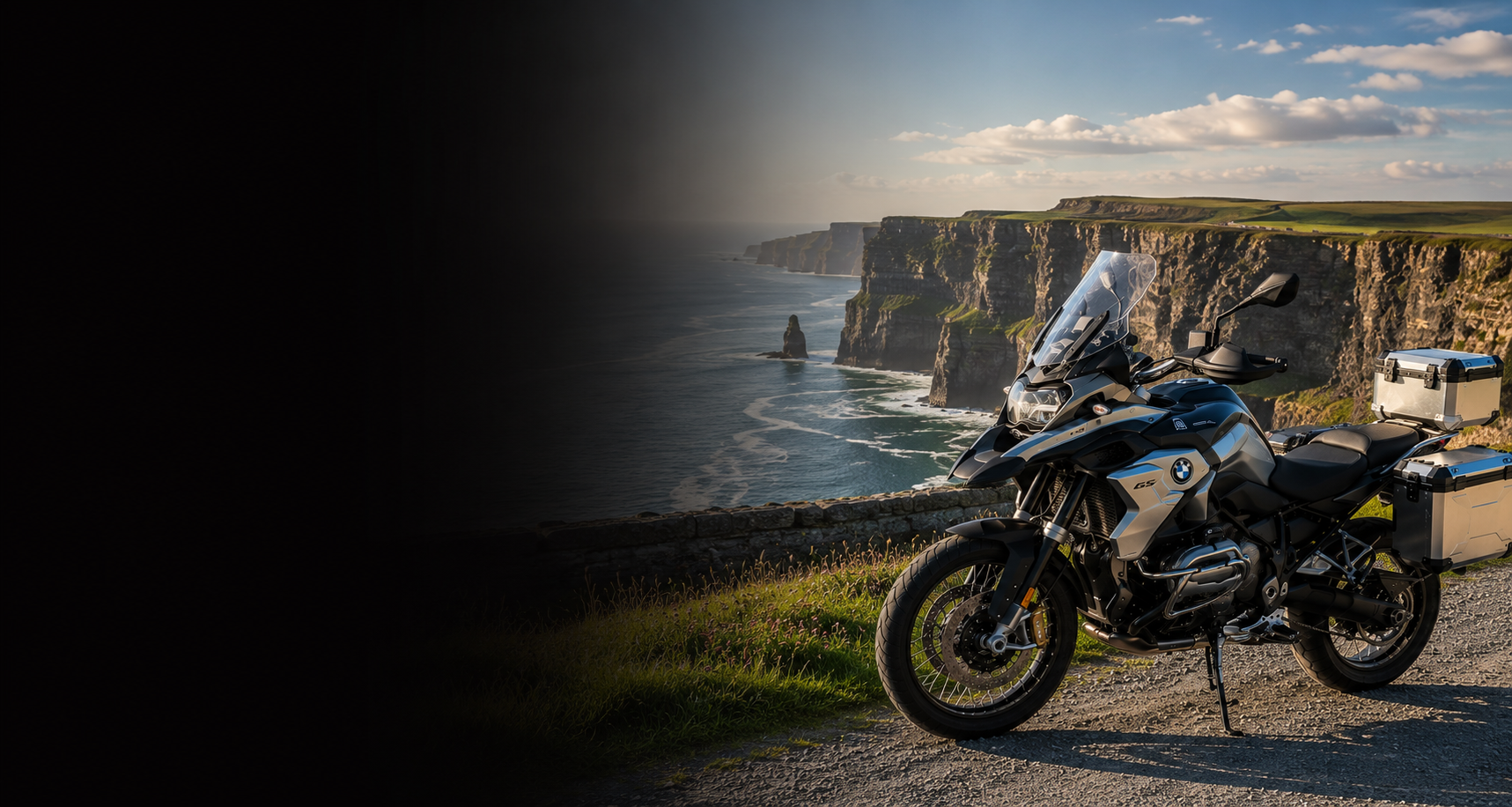 BMW adventure motorcycle beside a the Cliffs of Moher on Ireland's Atlantic coast